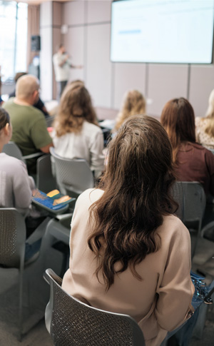 Group of people sitting for a presentation